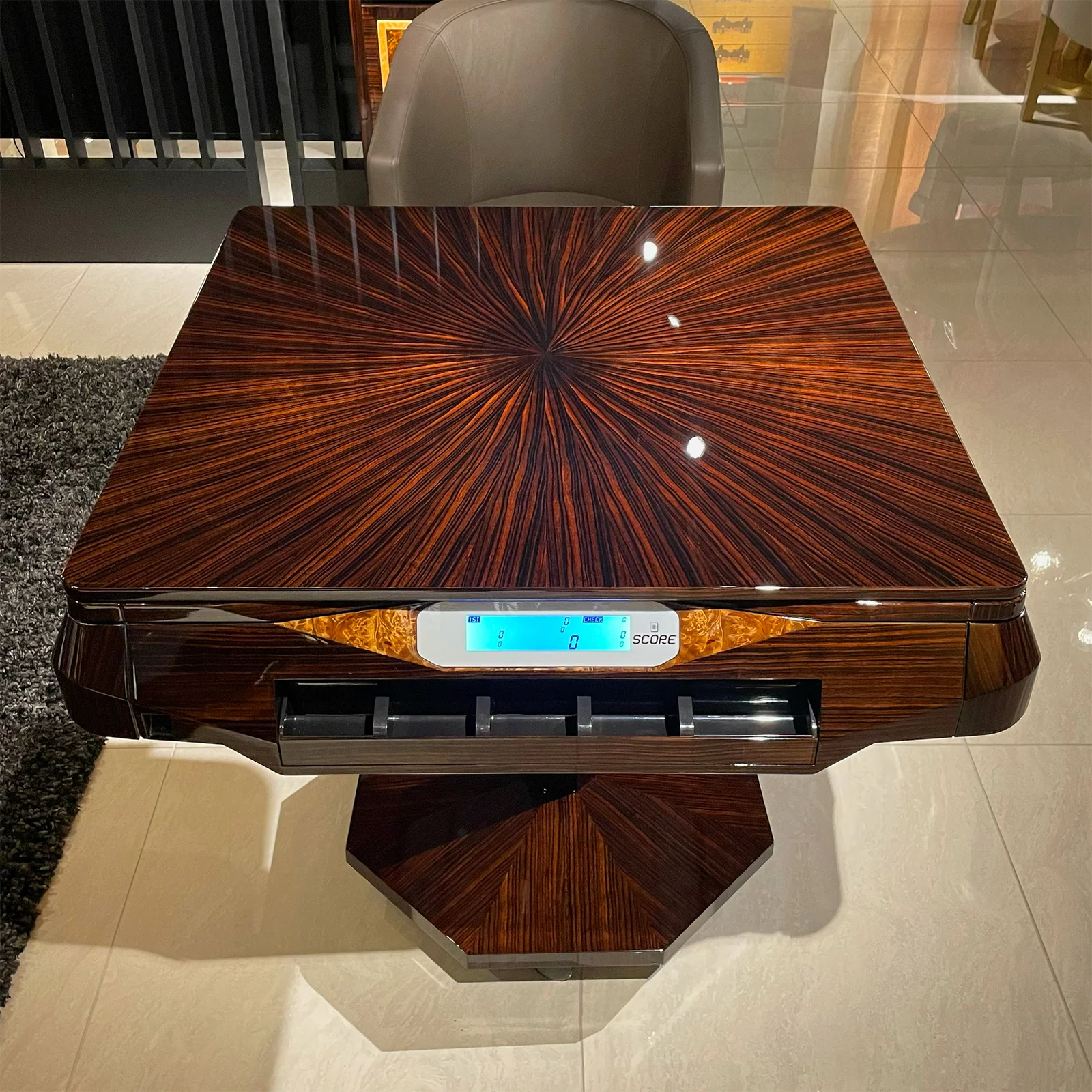 Sunburst ebony grain of the Matsuso bespoke table top, seen from above